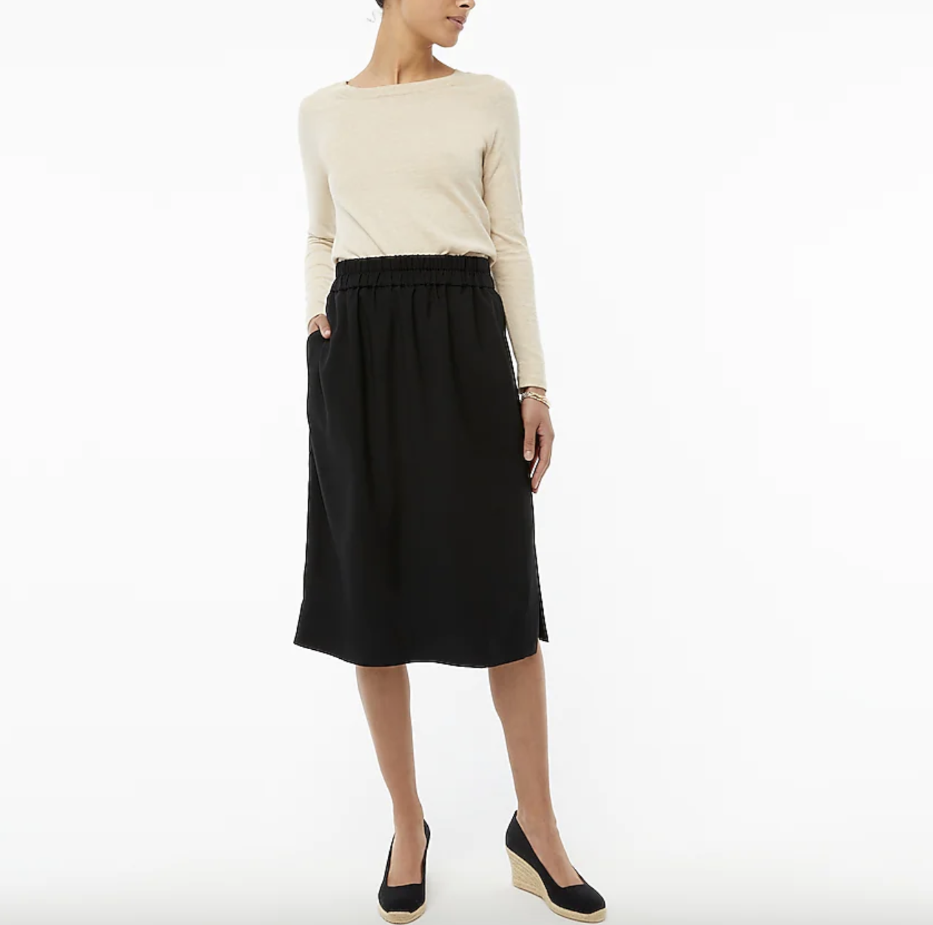 bottom half, model wearing black midi skirt