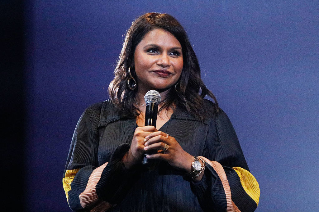 Mindy holding a microphone