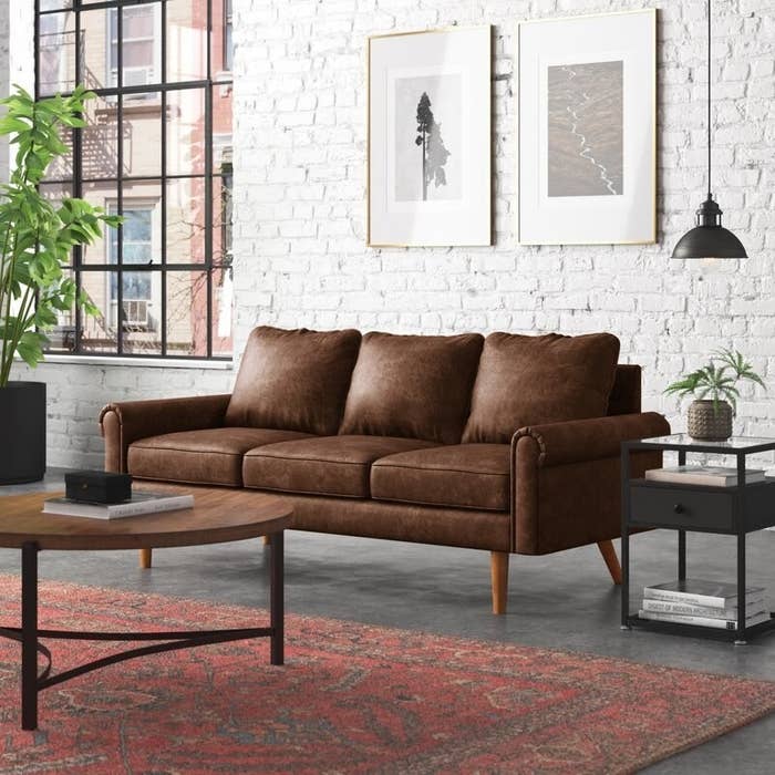 The rolled arm sofa in dark brown