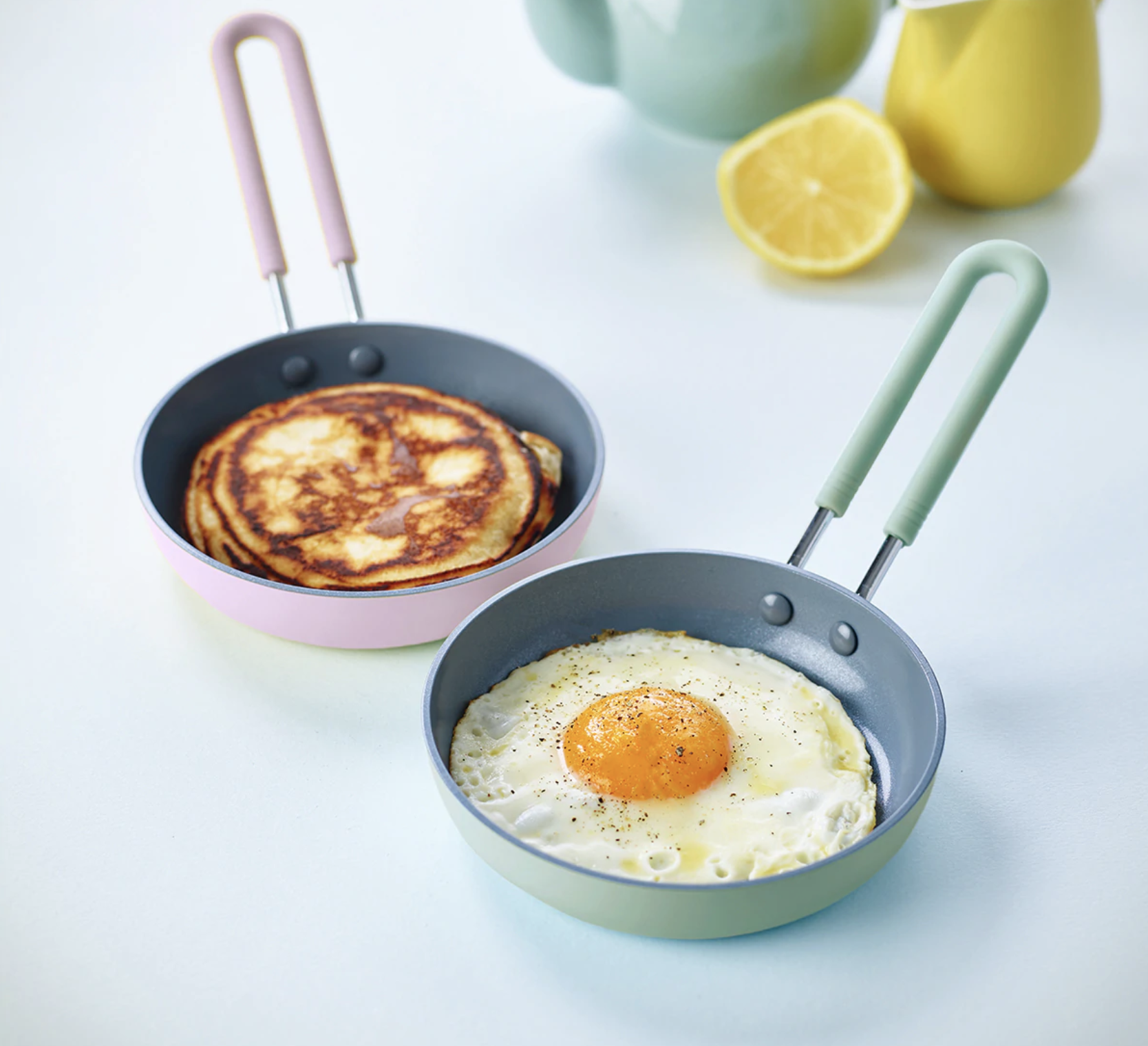 An egg and a pancake in two mini frying pans