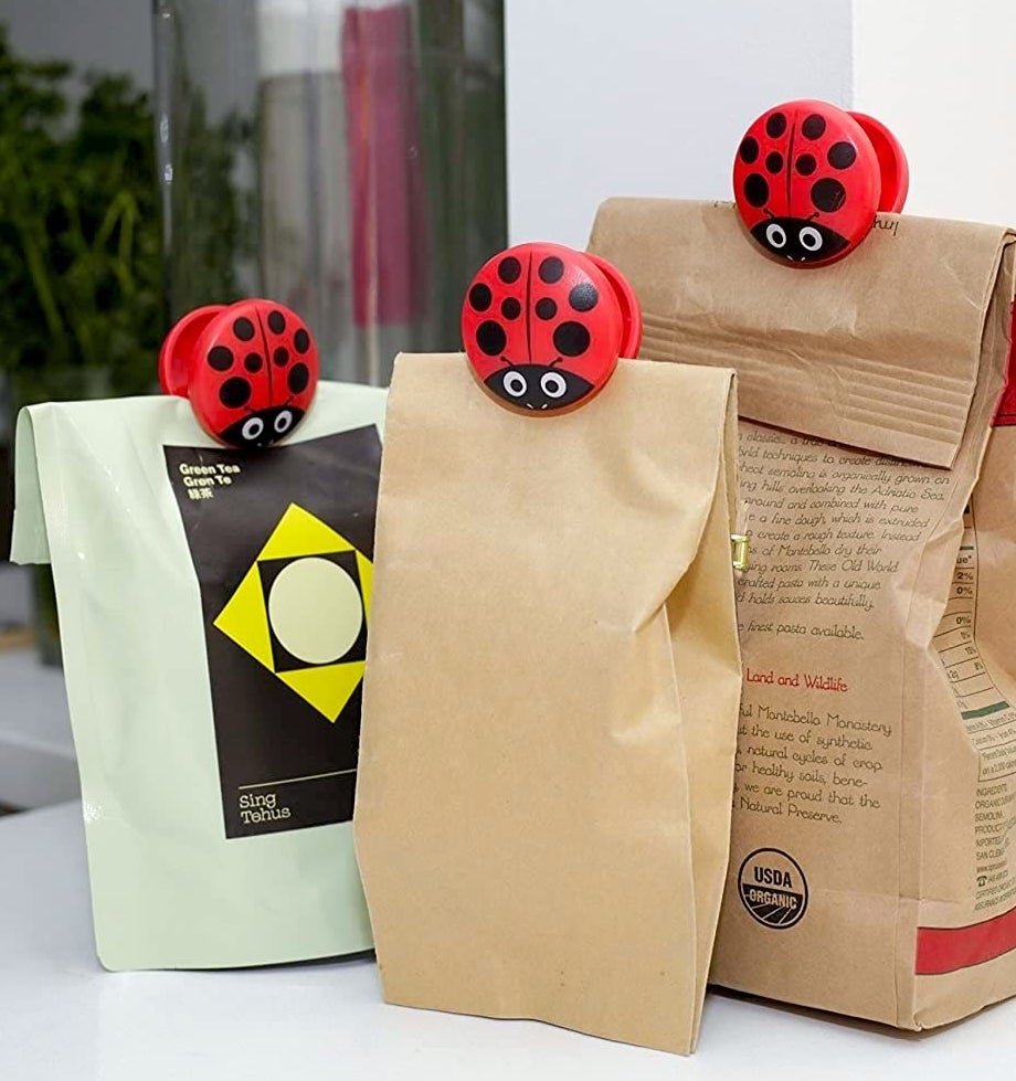 Three bags with ladybug clips on them