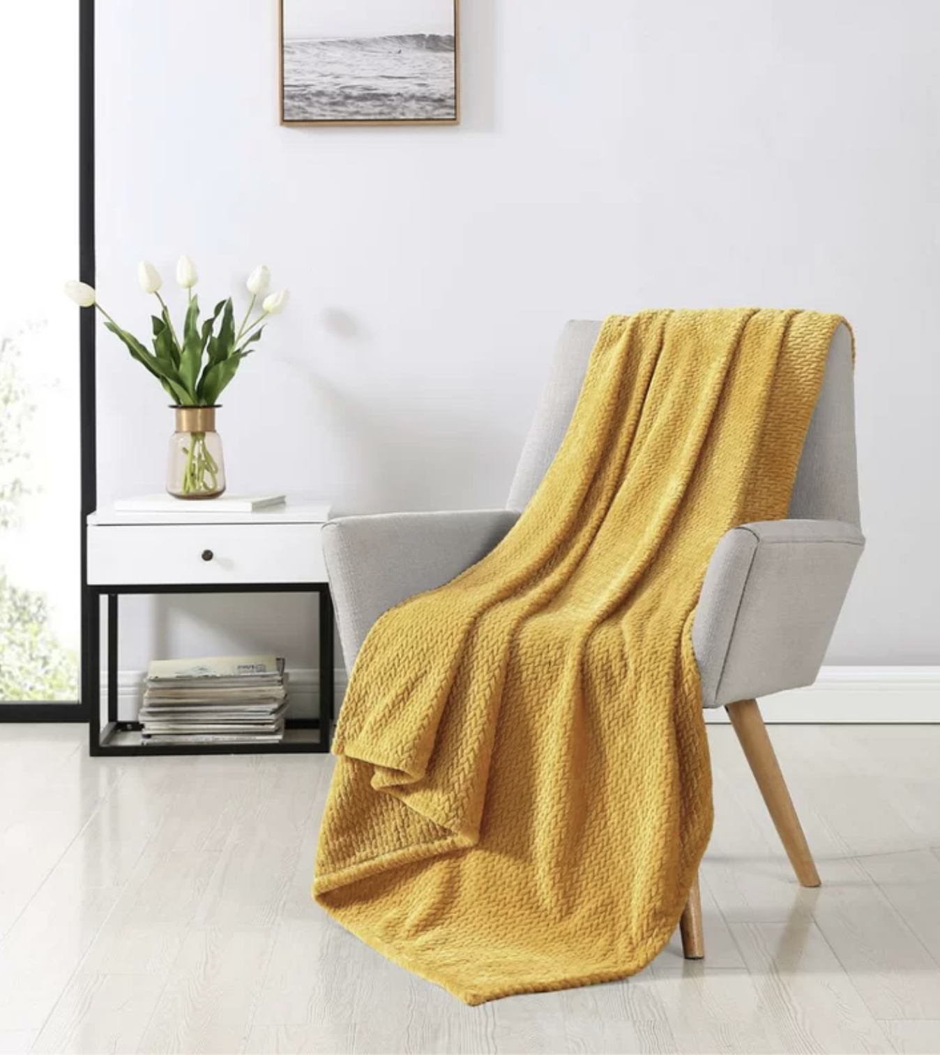 A gold throw blanket on a chair