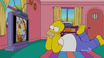 Homer watching a flat screen TV on The Simpsons