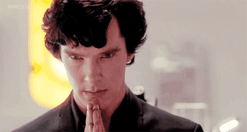 gif of Sherlock Holmes from BBC&#x27;s Sherlock raising one eyebrow and looking intrigued