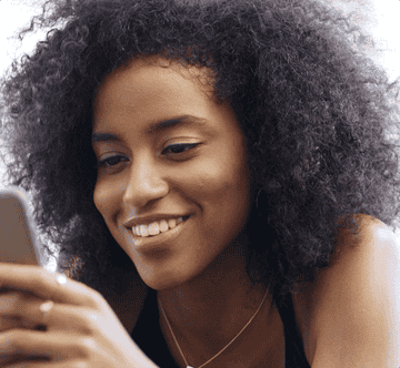 An animation of a woman looking at a screen and smiling.