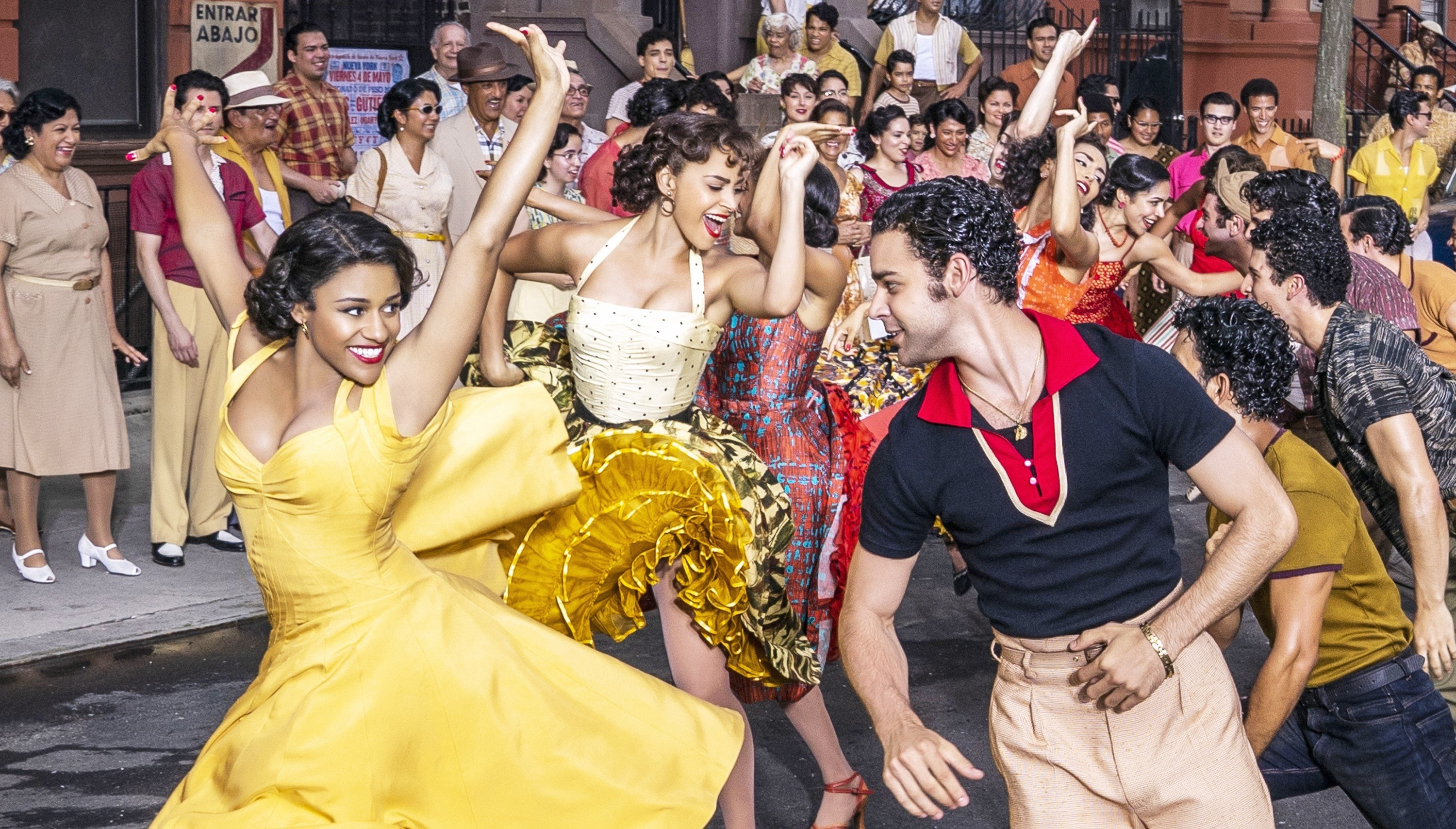 Ariana DeBose and David Alvarez dance in a crowd