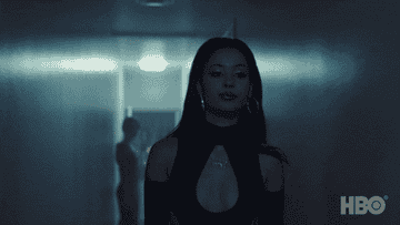 Maddy walking down a house hallway