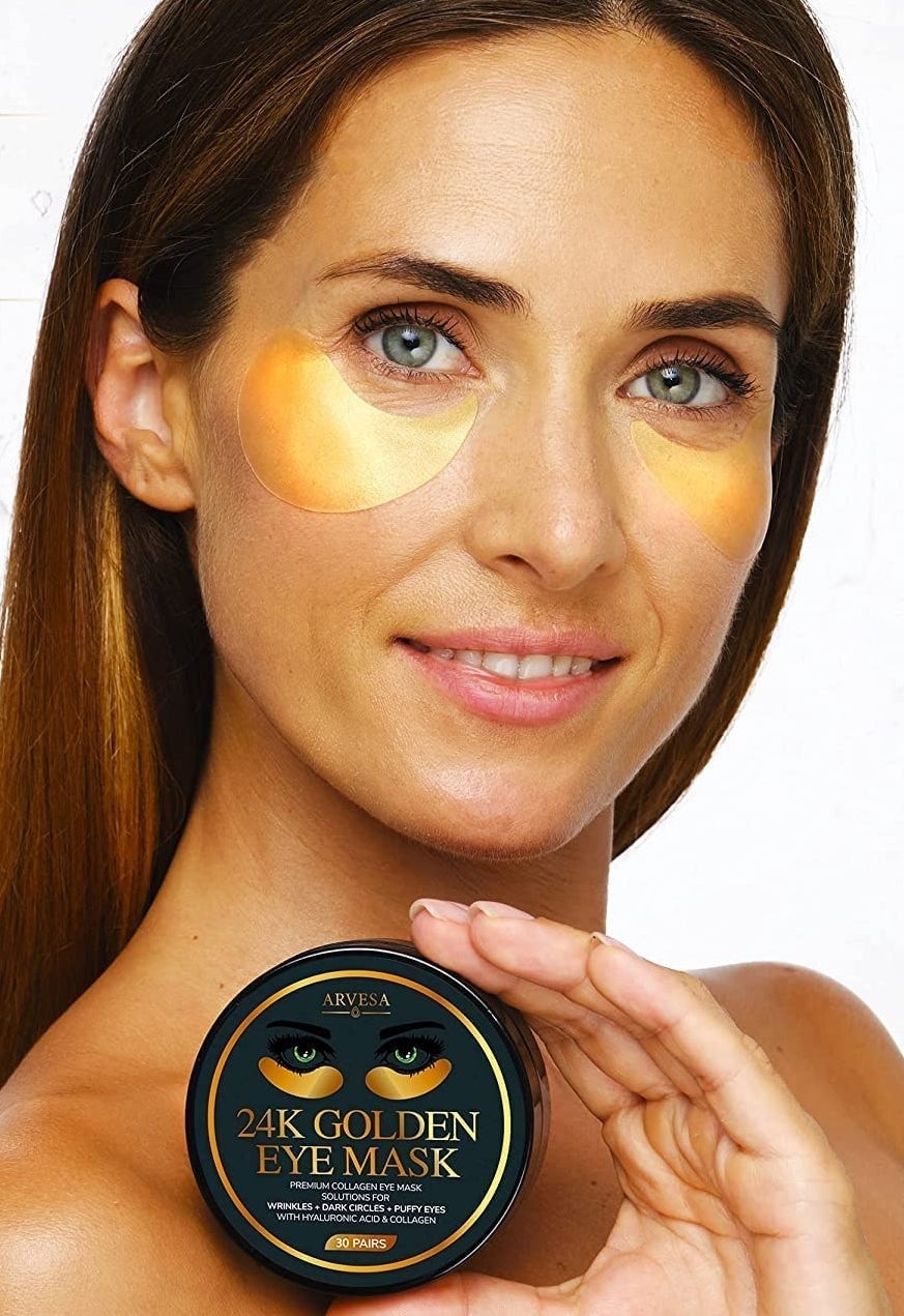 A person with the eye gels on, holding up the jar