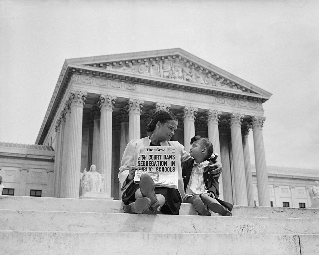 Nettie Hunt and her daughter Nickie sit on the steps of the U.S. Supreme Court