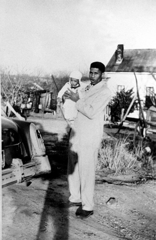 Medgar Evers holding his baby son Darrell