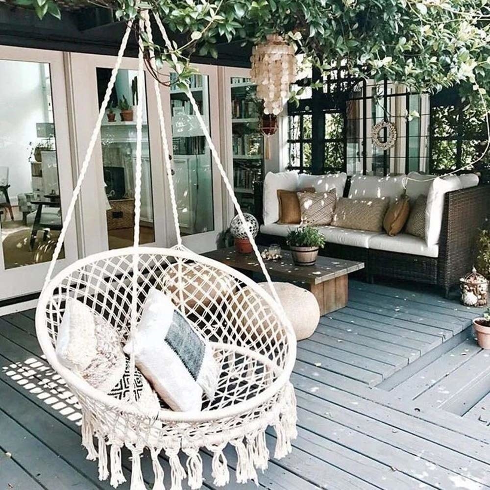 white hammock/swing chair on a deck
