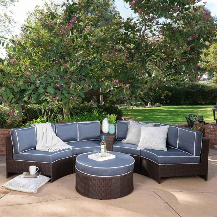 four-piece wicker conversation set with blue cushions