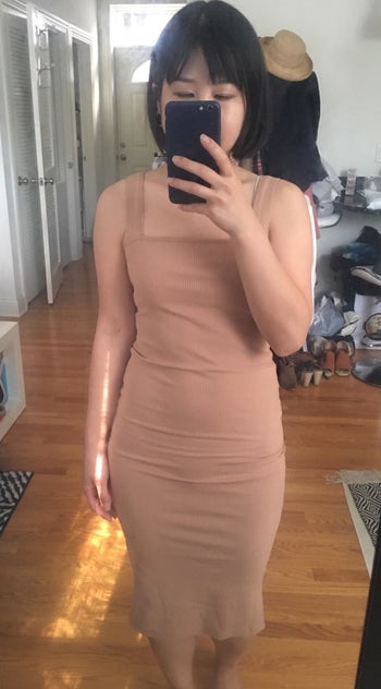 the beige dress being worn by a reviewer