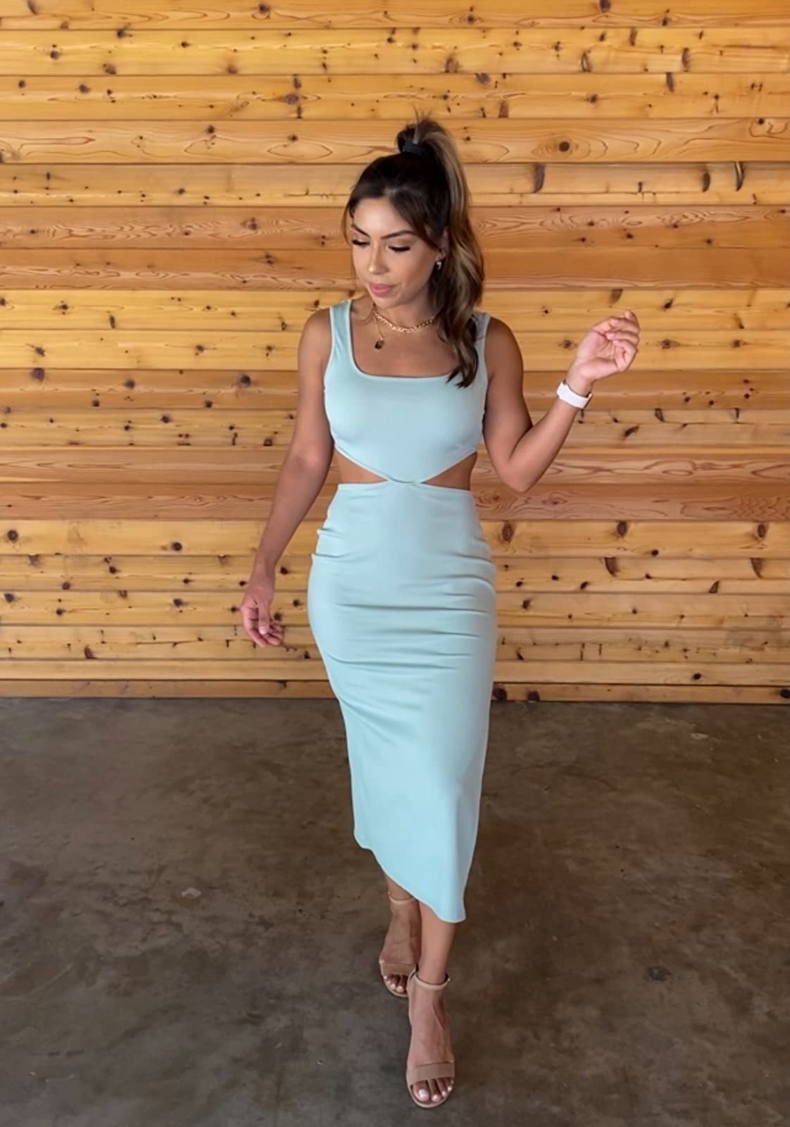 a reviewer wearing the dress in mint green