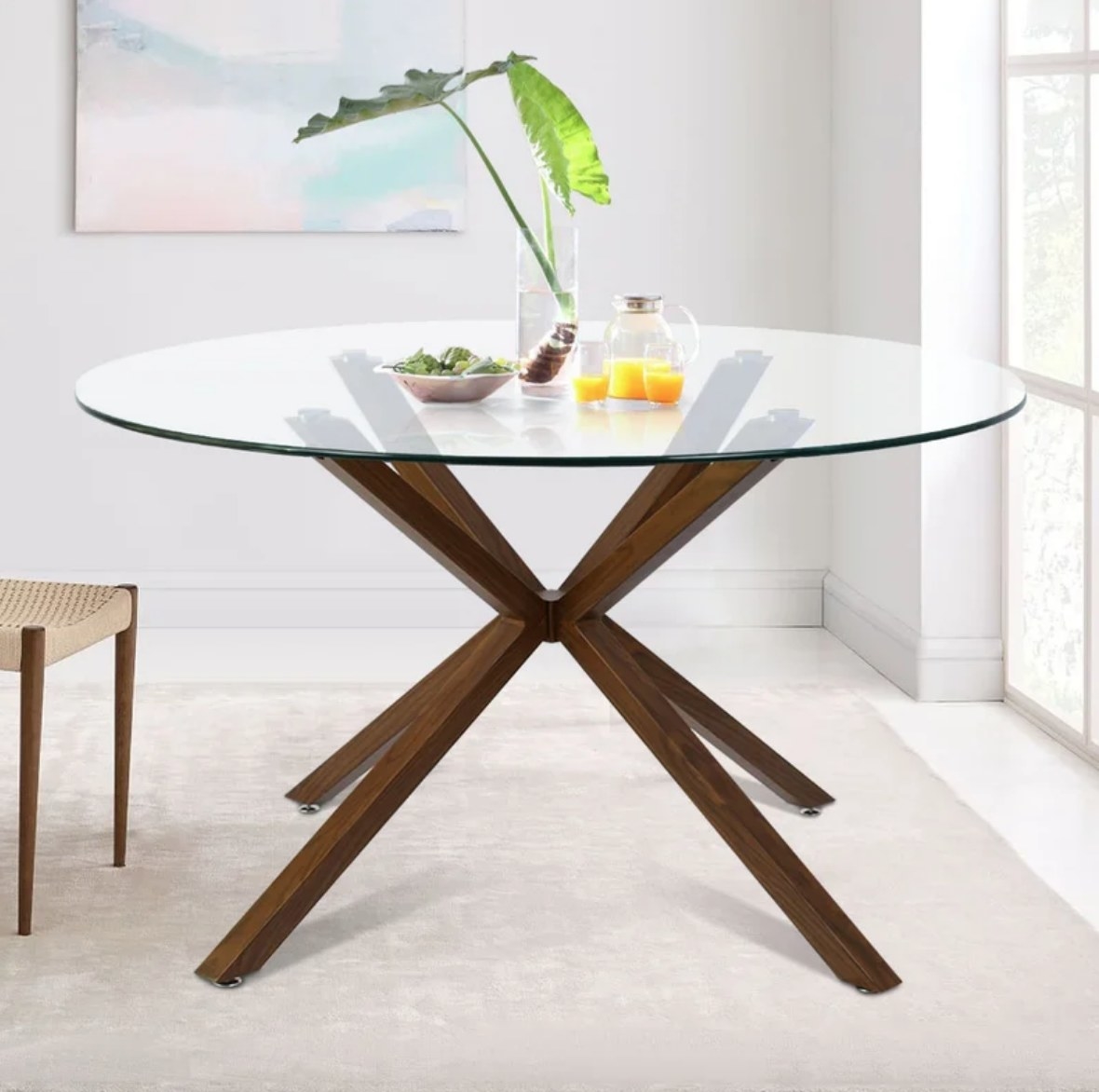 Glass top round table with brown legs