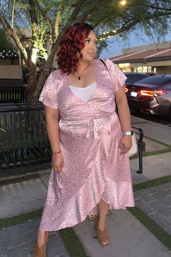 a different reviewer wearing the dress in pink with a white tank top underneath