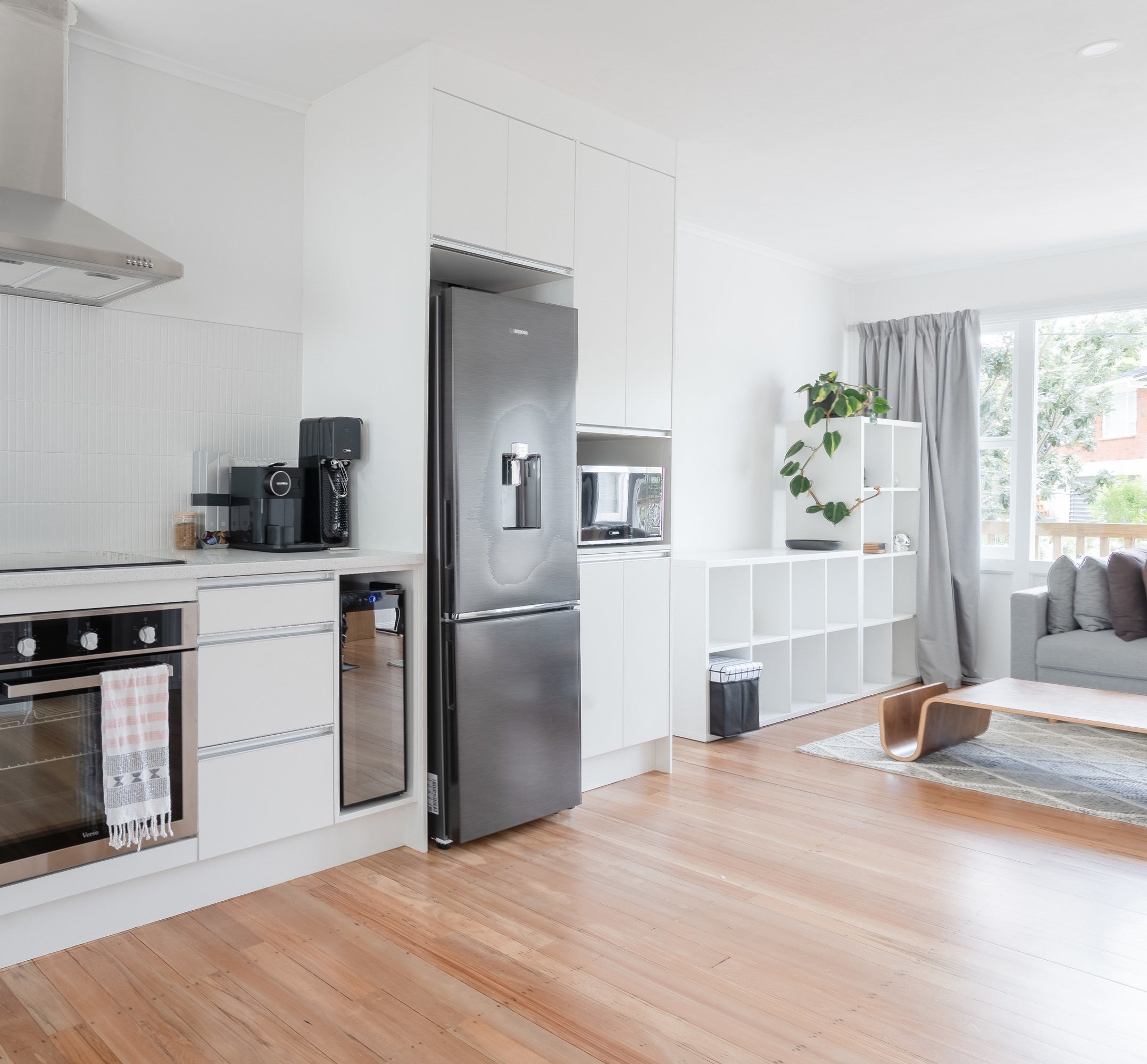 Open floor plan between a kitchen and a small living room