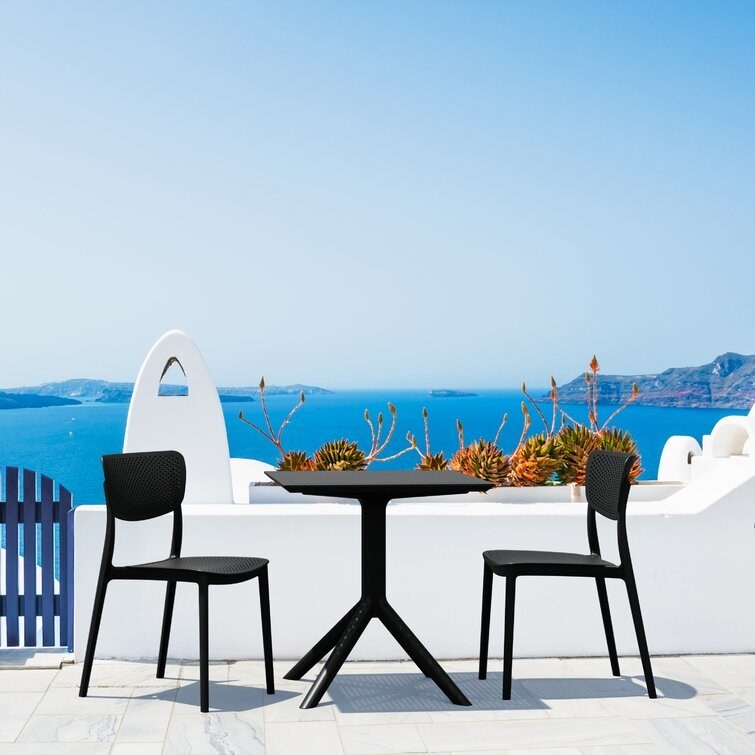 the black two person dining set outside