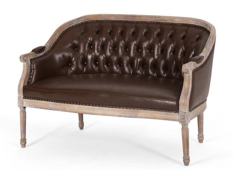 A french country style love seat in dark brown