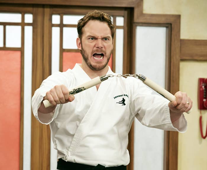 Andy from &quot;Parks and Rec&quot; holding nunchucks
