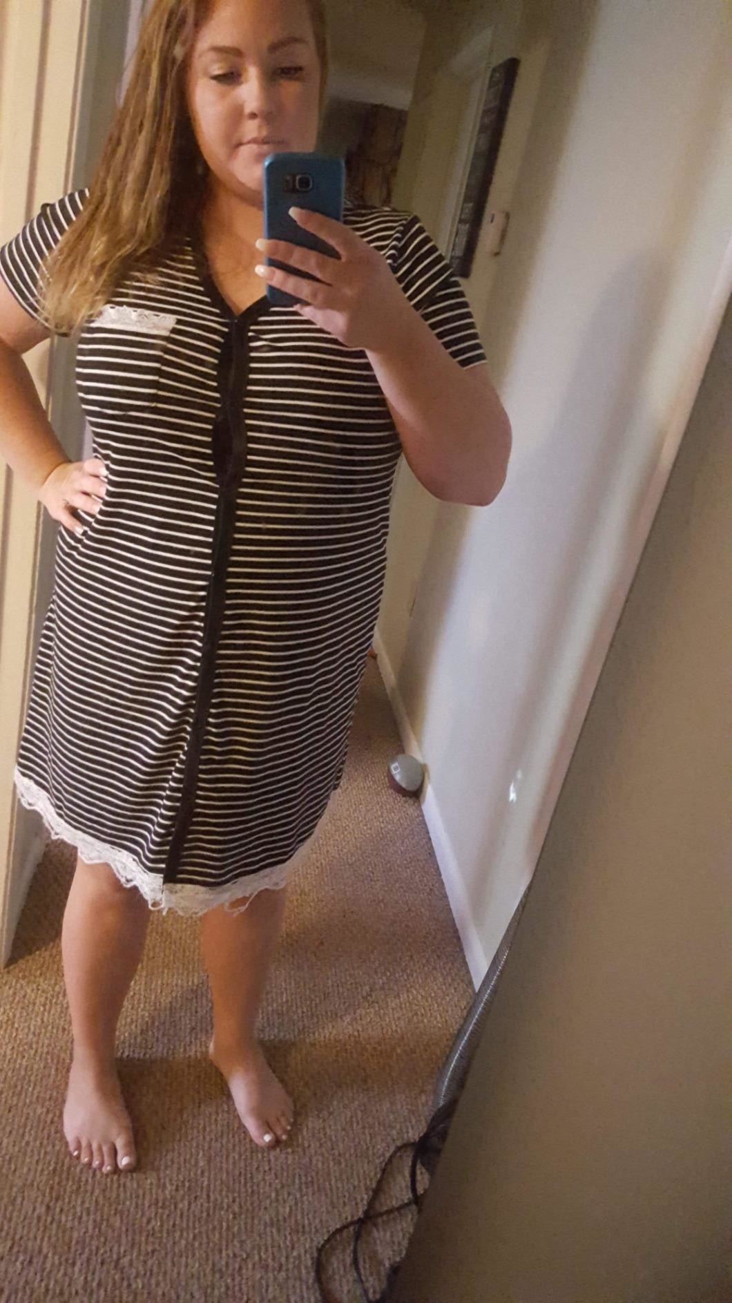 reviewer mirror selfie wearing black and white striped nightgown