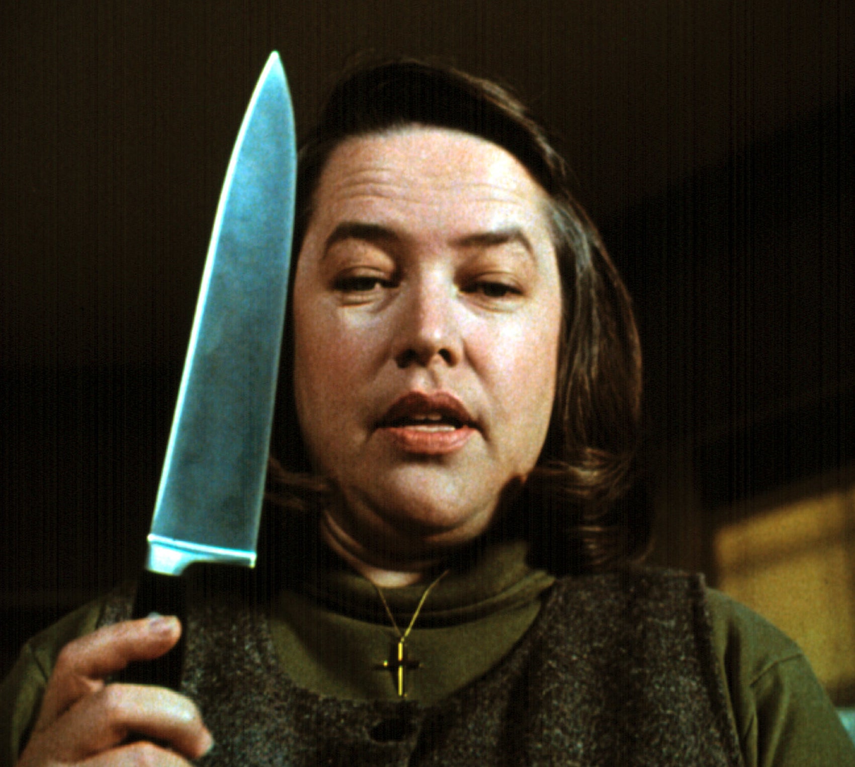 Kathy Bates as Annie, holding a giant butcher knife