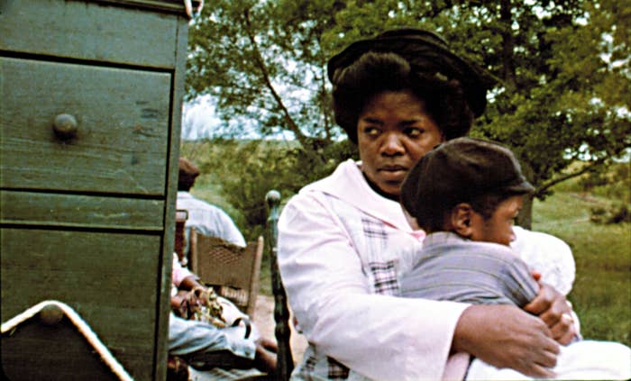 Winfrey clutches a child outside