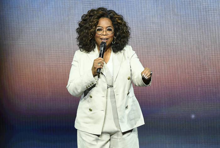 Winfrey talks into a microphone