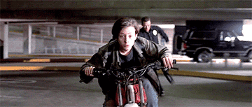 GIF of the T-1000 chasing John Connor through a parking garage