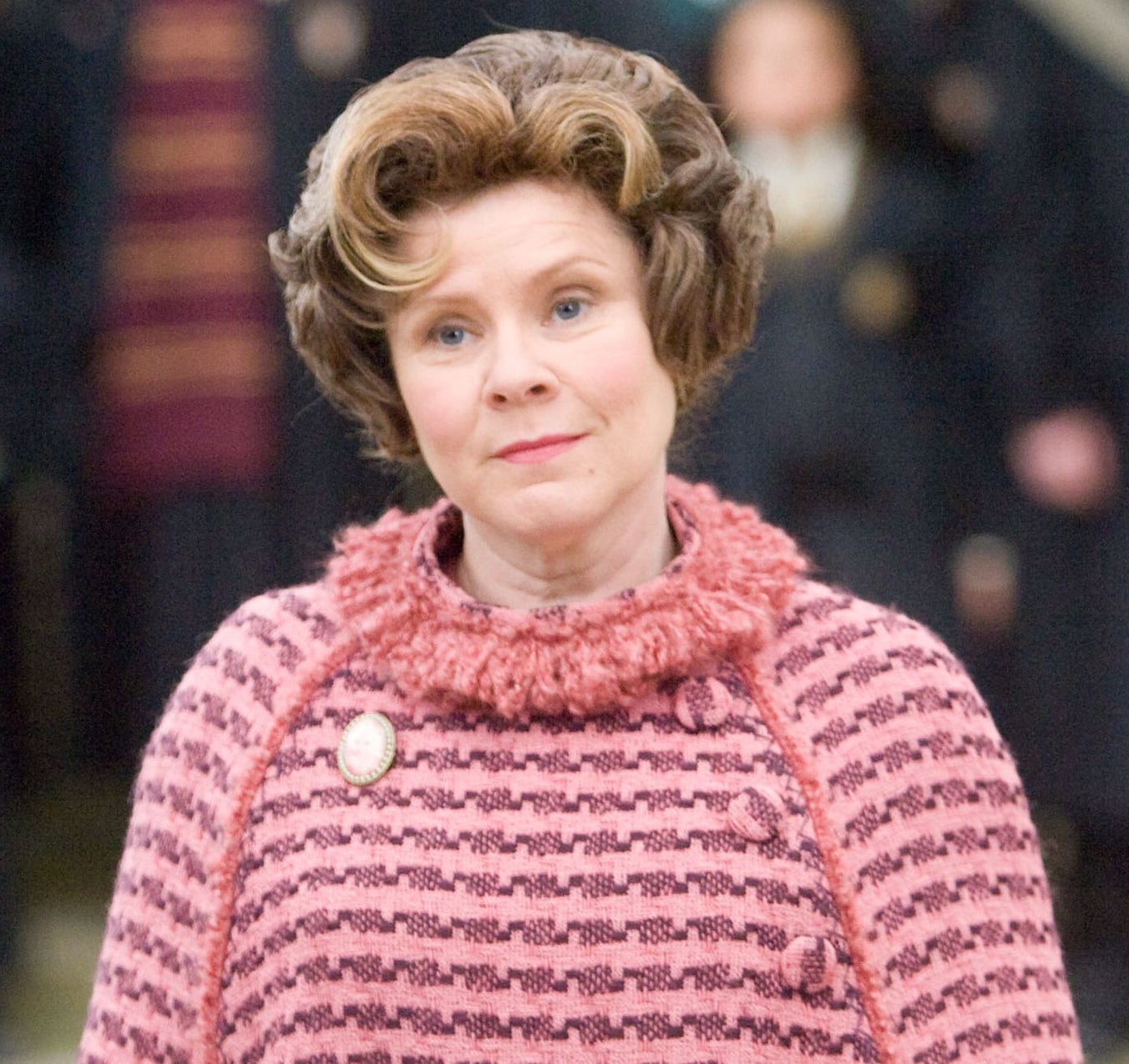 Delores Umbridge in all pink and looking smug