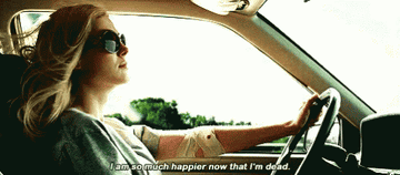 GIF of Pike in Gone Girl driving a car, and voiceover saying &quot;I am so much happier now that I&#x27;m dead&quot;
