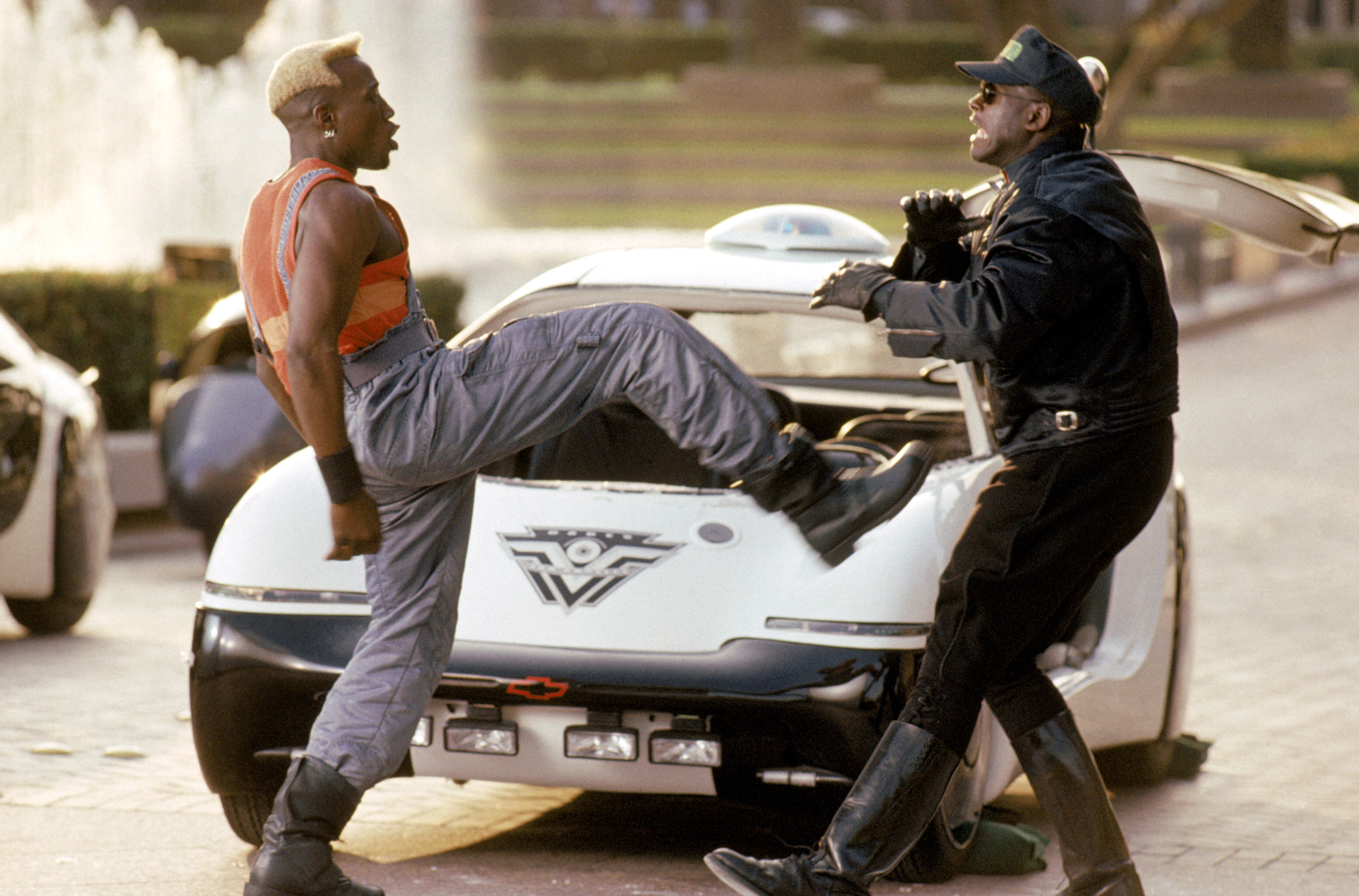 Snipes as Phoenix kicking at a police officer