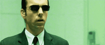 GIF of Agent Smith talking to Neo