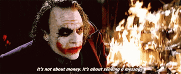 GIF of the Joker saying &quot;It&#x27;s not about money; it&#x27;s about sending a message&quot; and standing in front of a burning pile of money