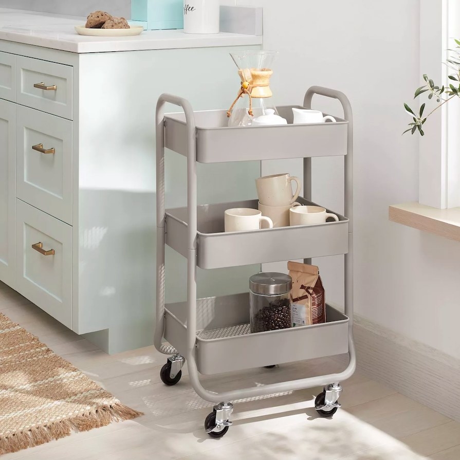 Gray rolling cart filled with various kitchen items