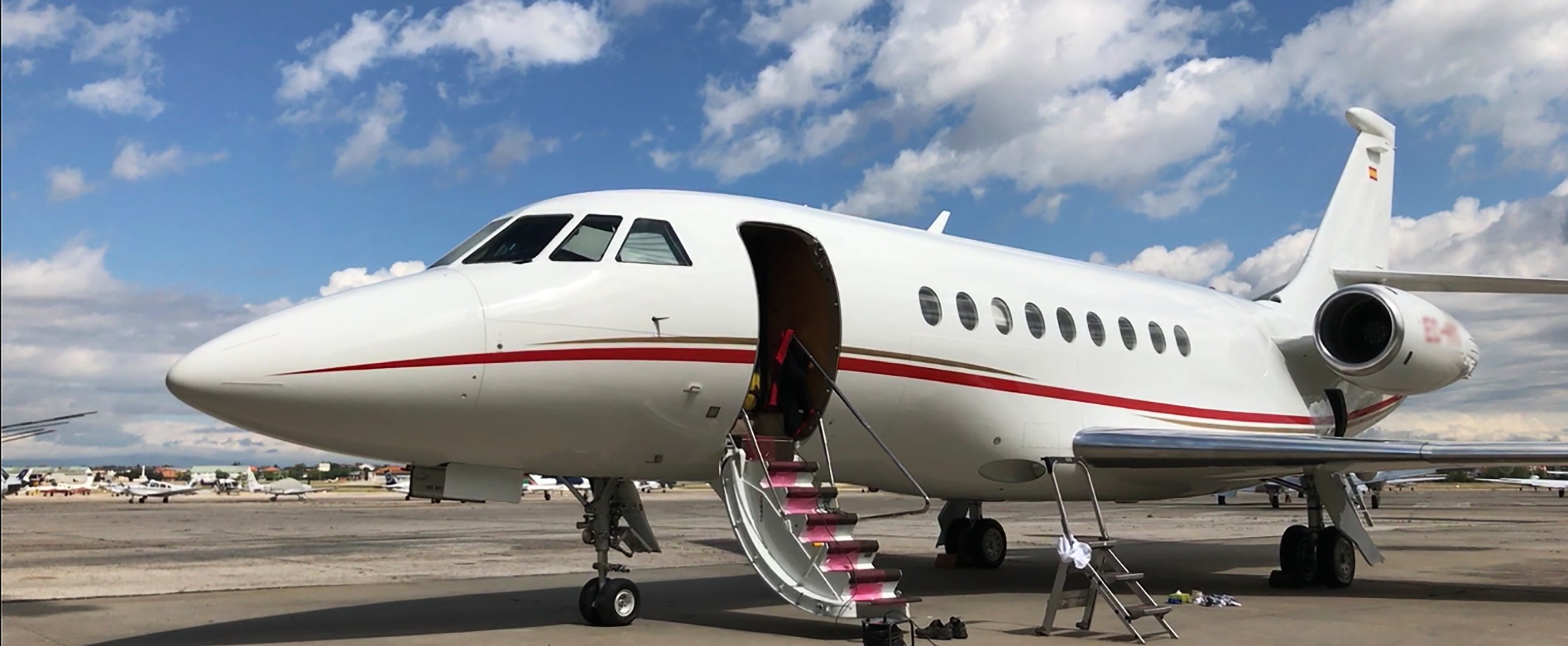 A private plane on the tarmac with the steps lowered