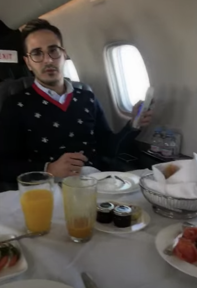 Simon eating on a private plane