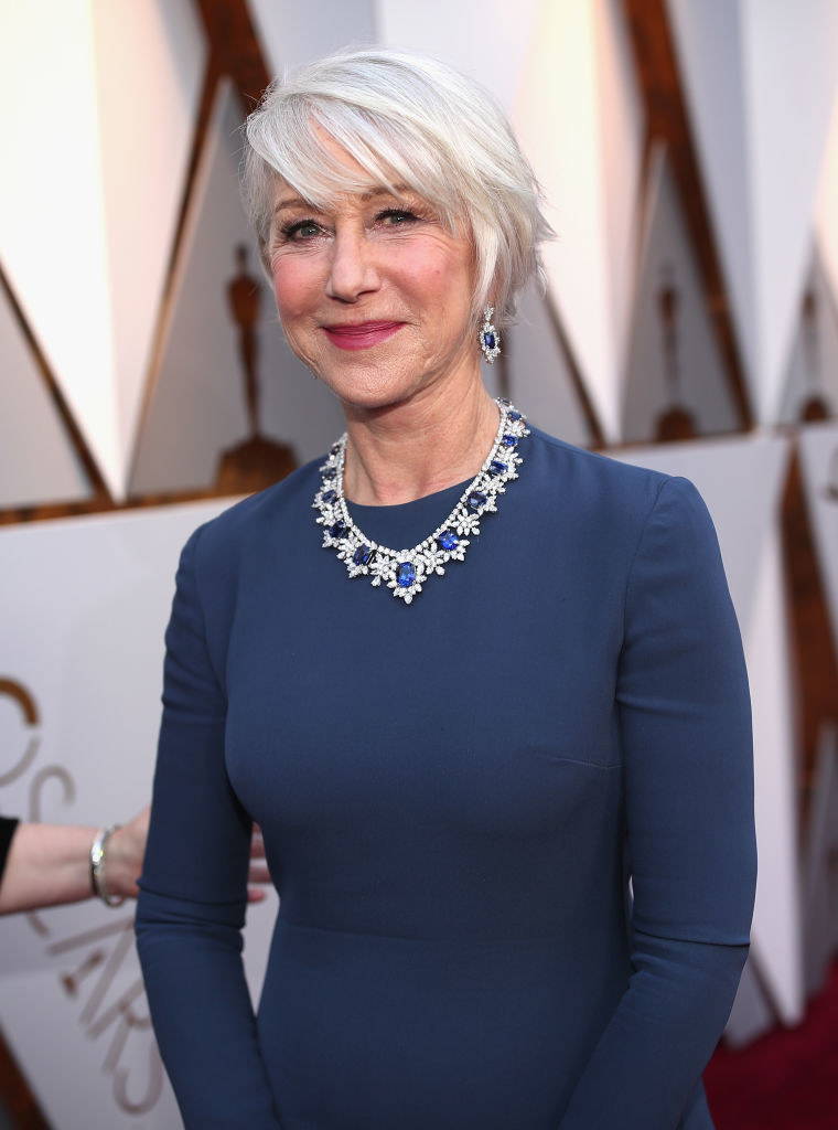 Helen smiling and wearing a necklace with large sapphires