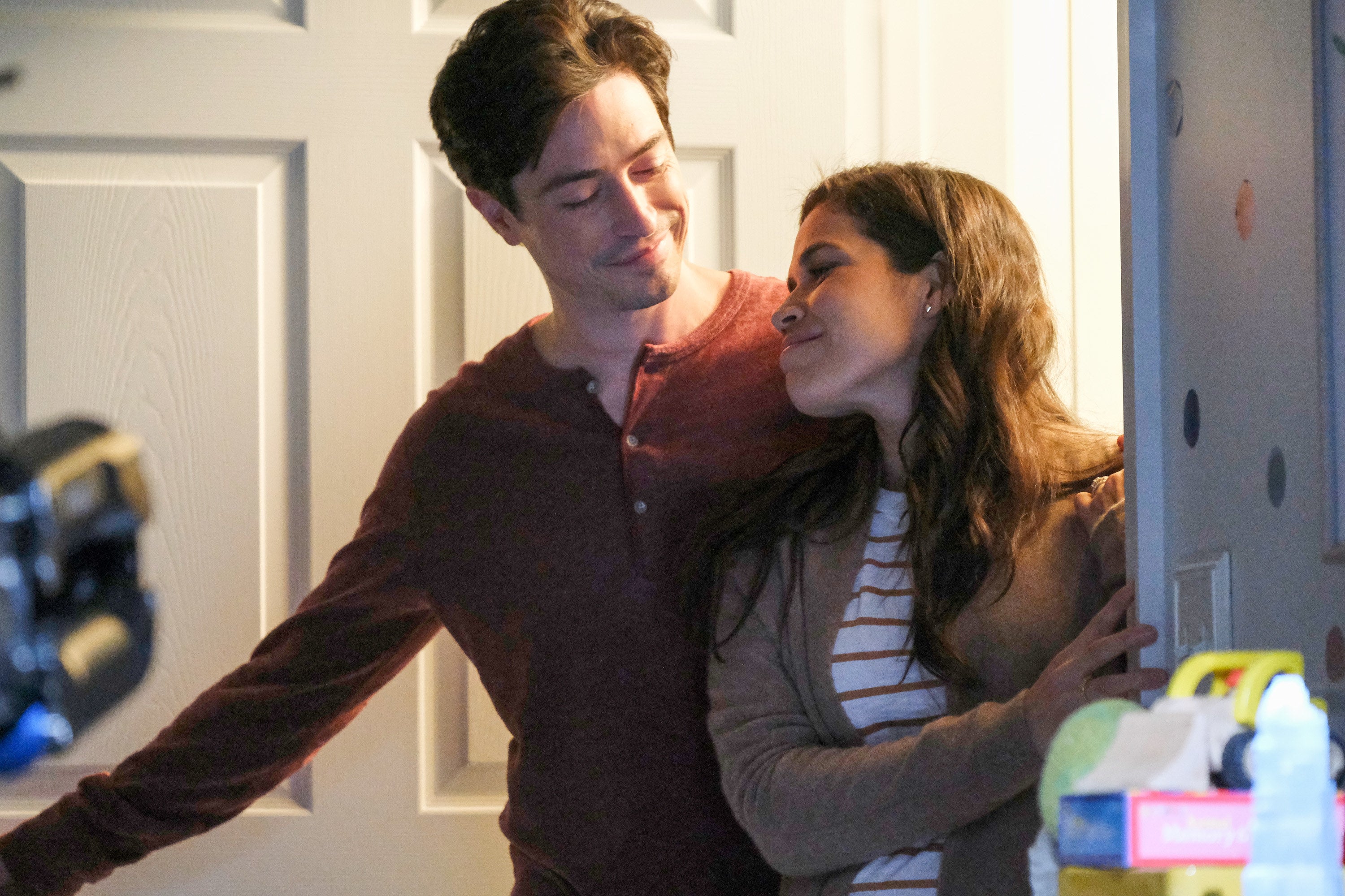 Jonah and Amy smiling at each other