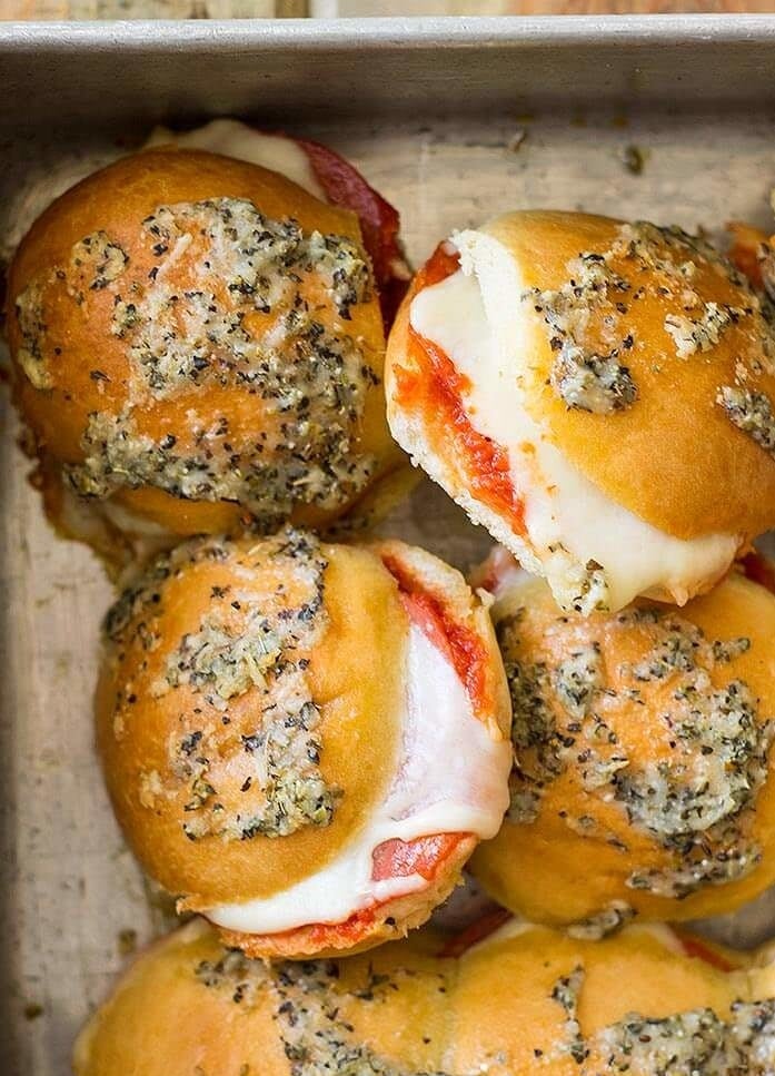 Pepperoni pizza sliders with garlic bread buns.