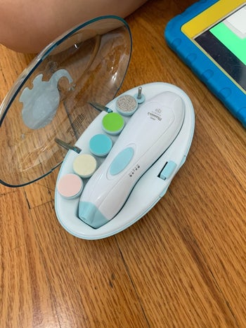 reviewer's photo of the baby nail clippers set with attachments