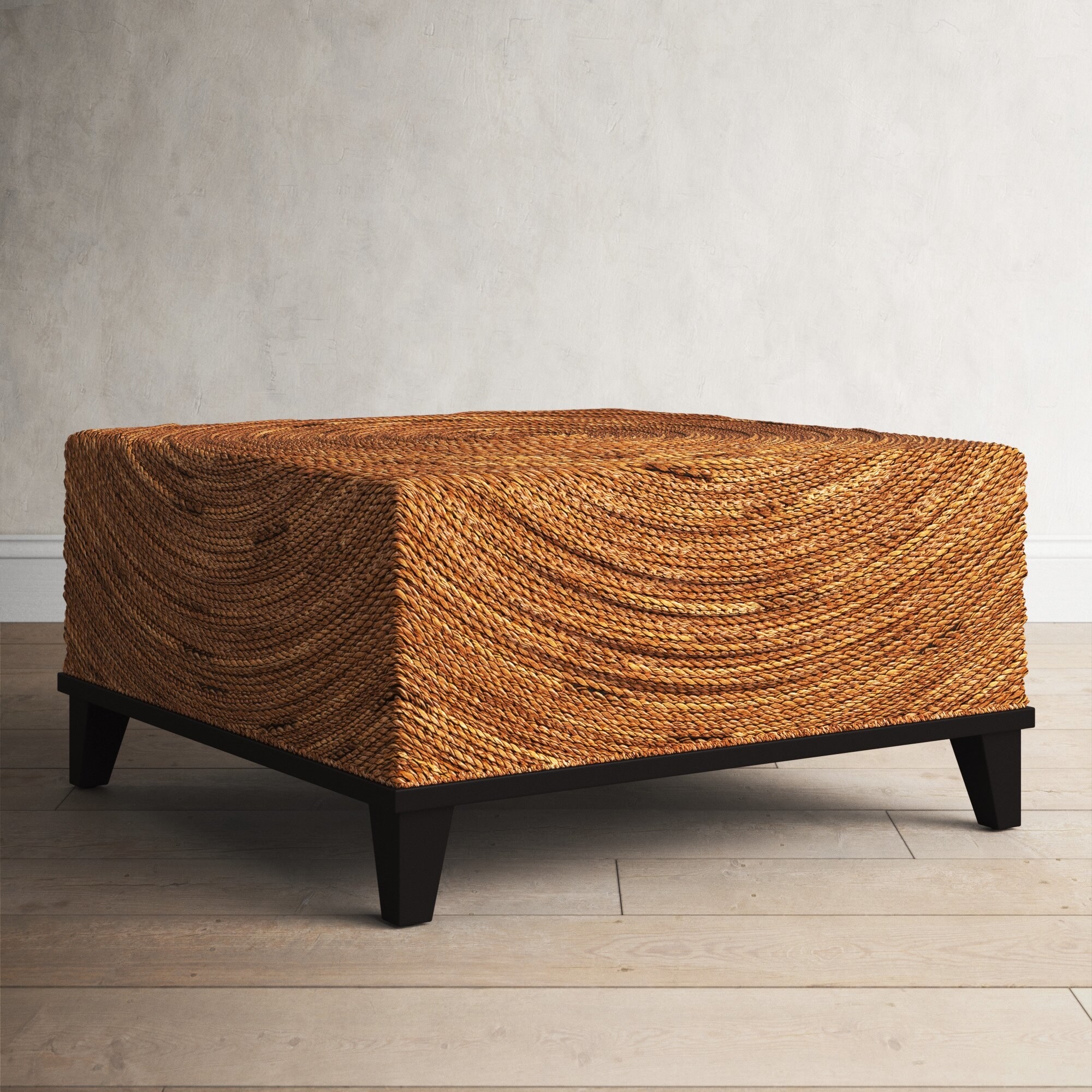 A rattan-type braided coffee table.