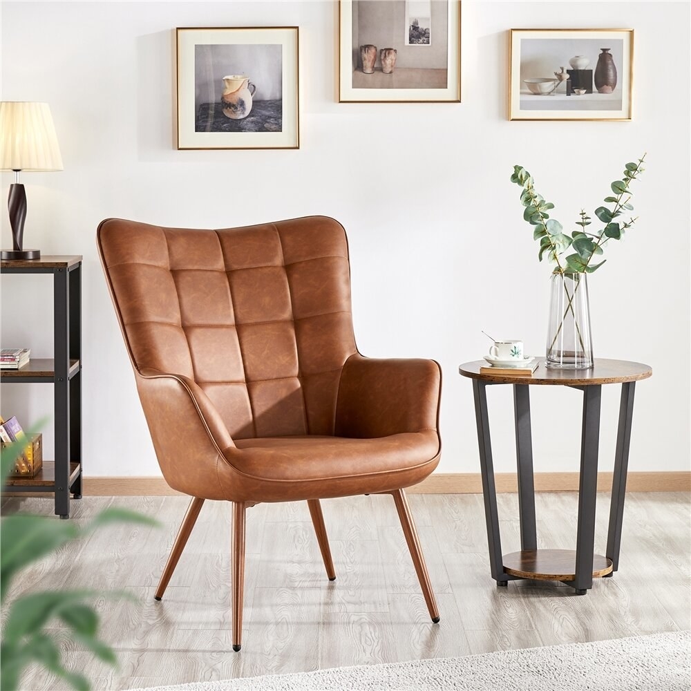 A leather-looking quilted chair in a living room.