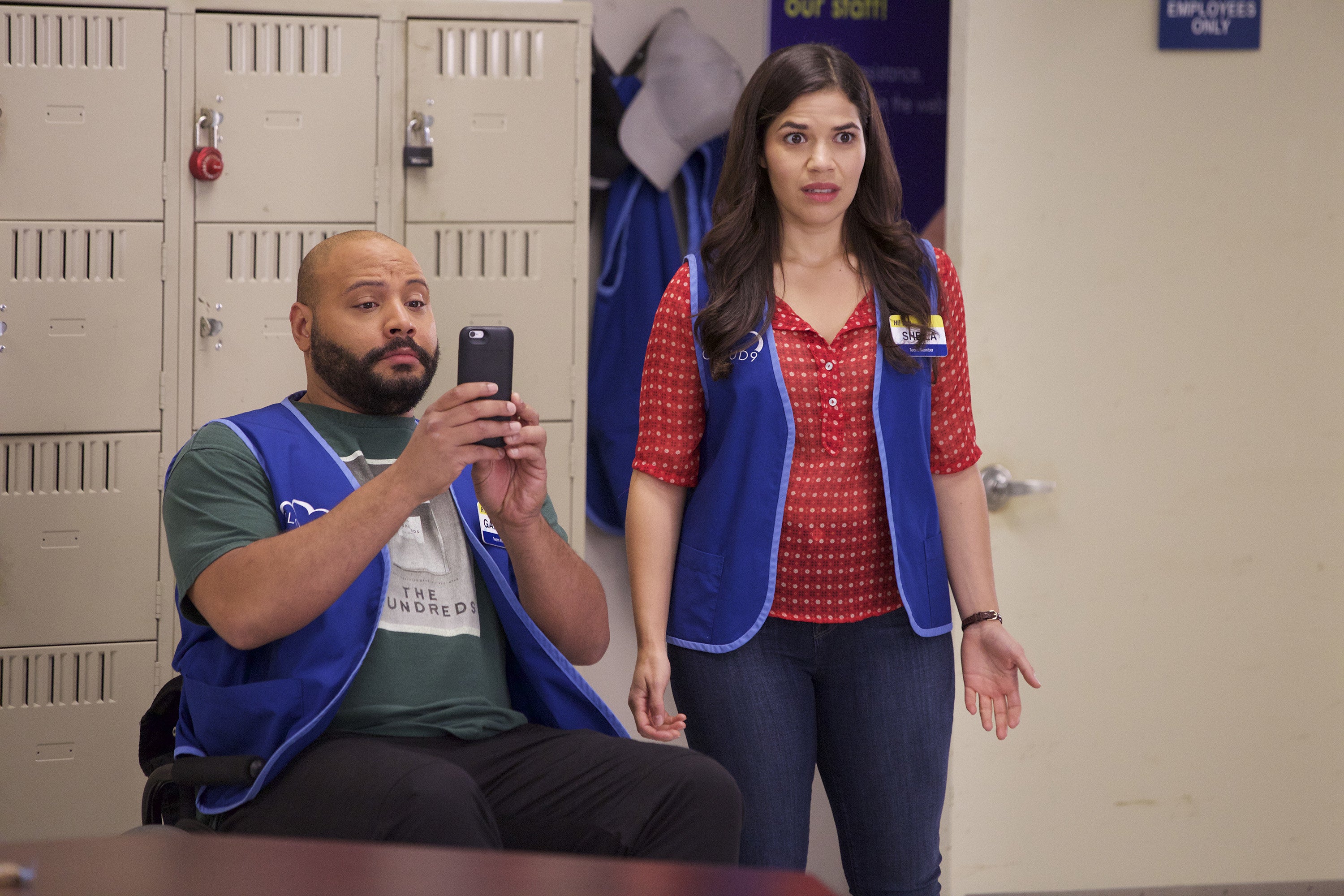 Amy looking disgusted and Garrett clicking a picture
