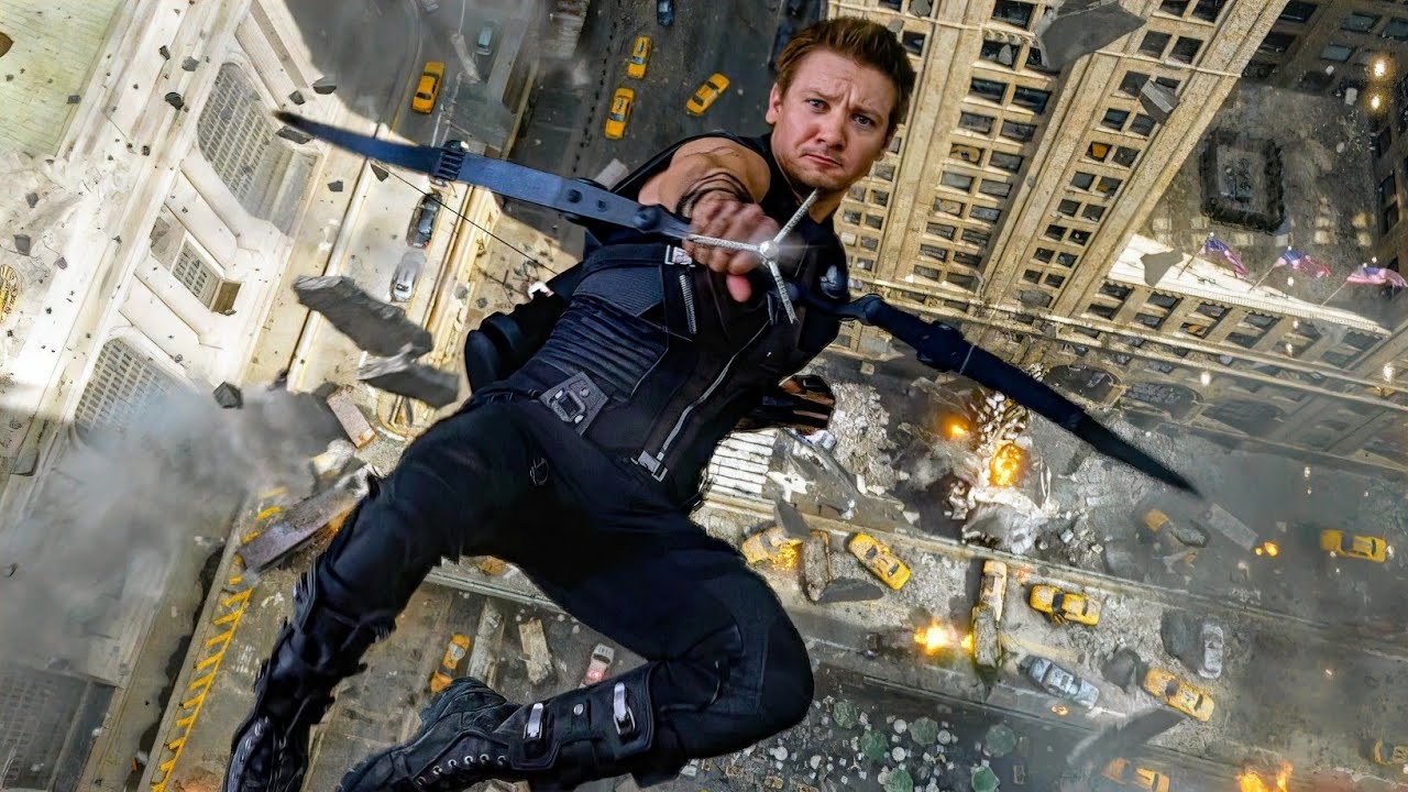 Clint Barton falling through the air at the Battle of New York, as he aims his bow upwards and shoots an arrow towards the camera