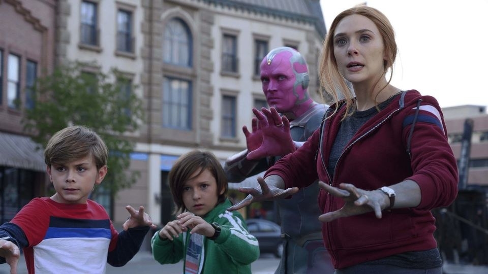 Wanda, Vision, and their sons Billy and Tommy all stood in fighting stances in the street as they prepare to fight the military