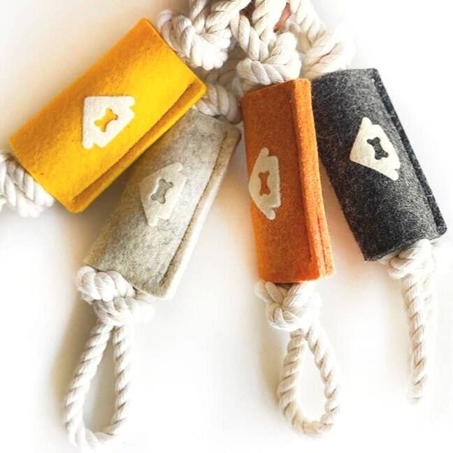 Rope tug toys with a wool design around the center