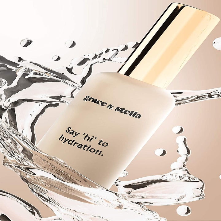The serum in its bottle with a splash of water around it