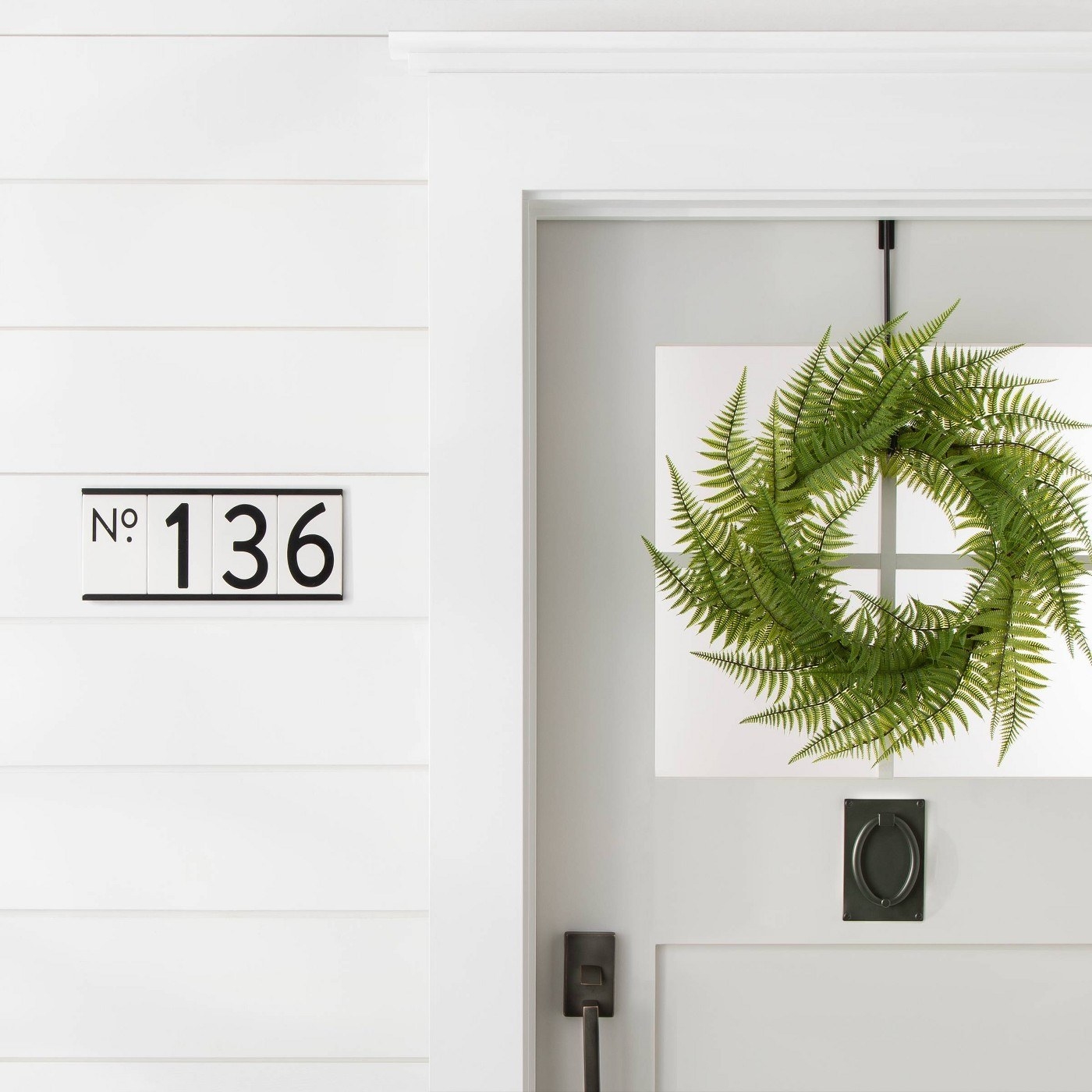 The farmhouse-style numbers set in the mounting plate (sold separately)