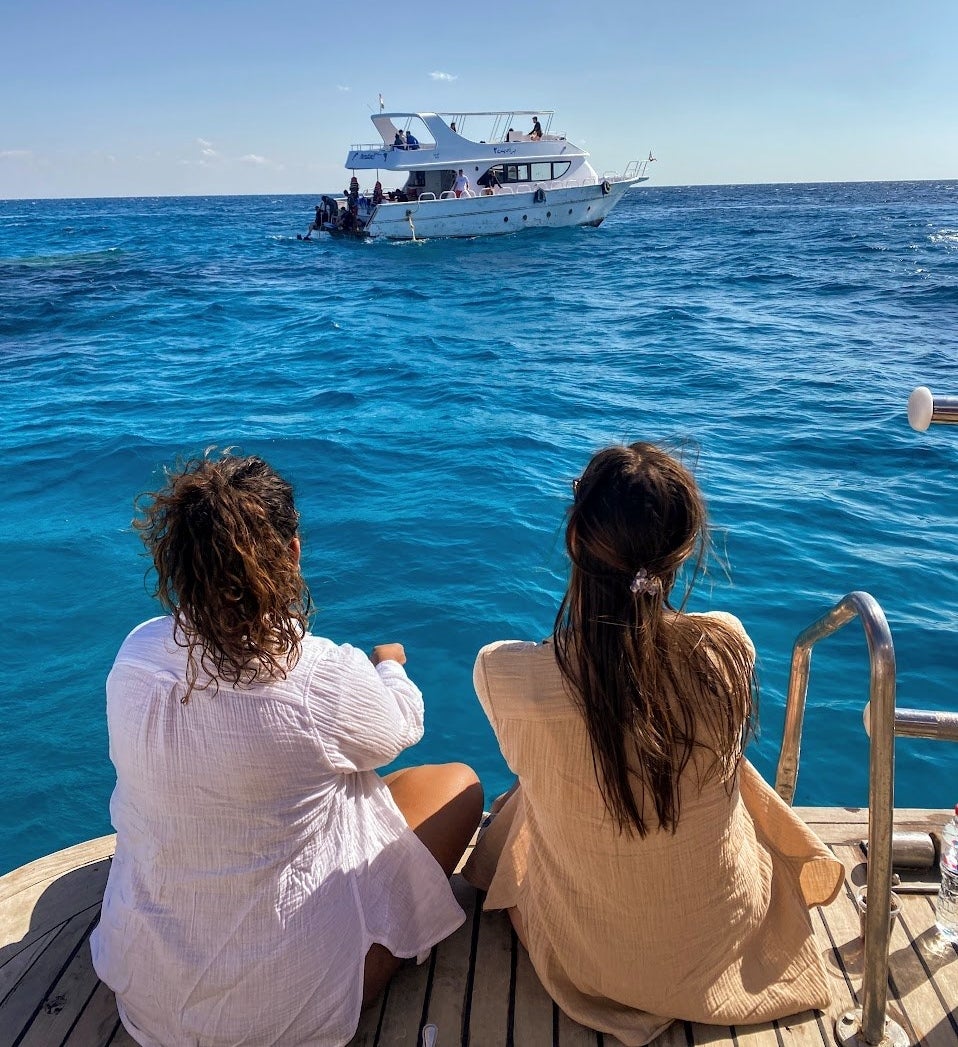 two people on a boat in the Red Sea